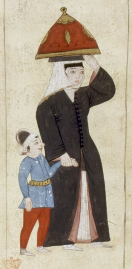 Woman and boy going to the hammam